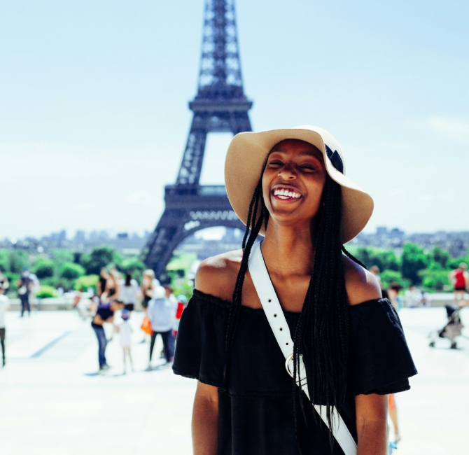 Rejection as Redirection: Black girl standing in front of eiffel tower